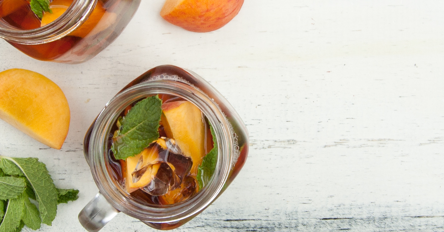Overhead shot of iced tea in a mason jar glass.
