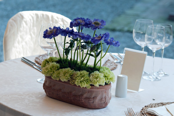 A purple floral wedding centerpiece.