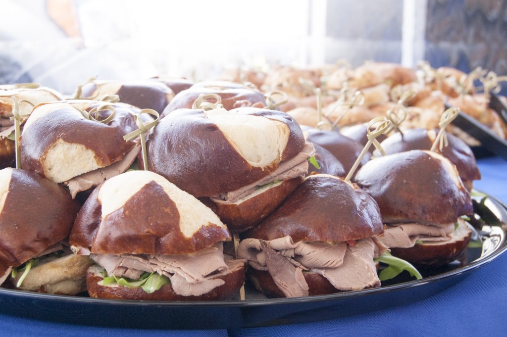 A bunch of turkey sandwiches on a tray.