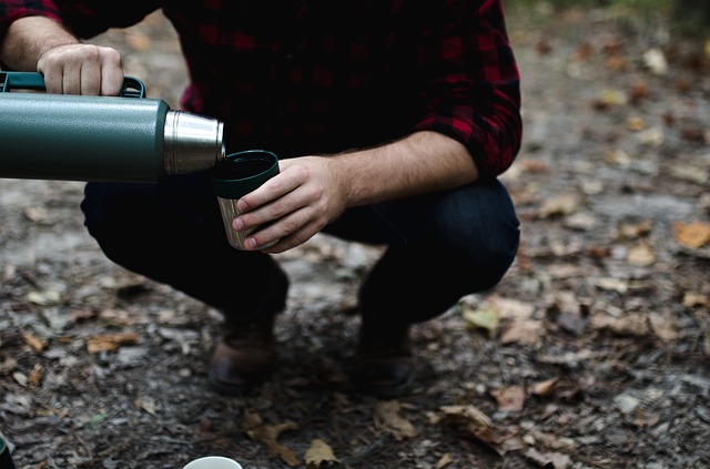 A man serving him self a drink.